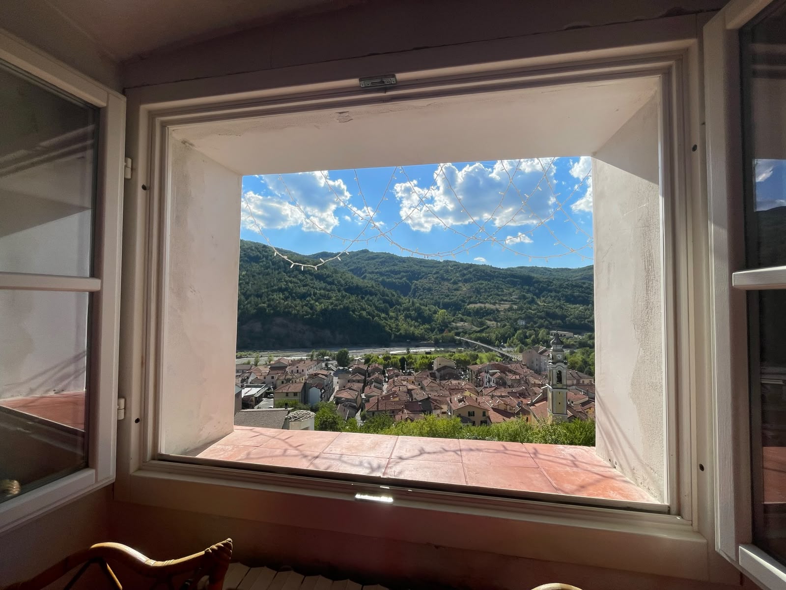 View from a window over the rooftops of Cabella and the surrounding hills
