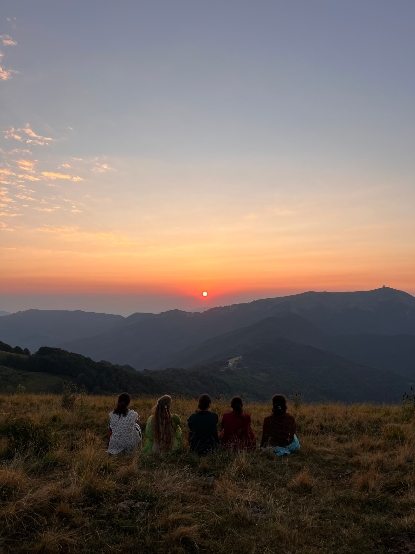 Yuvashakti watching the sun set over the hills above Cabella