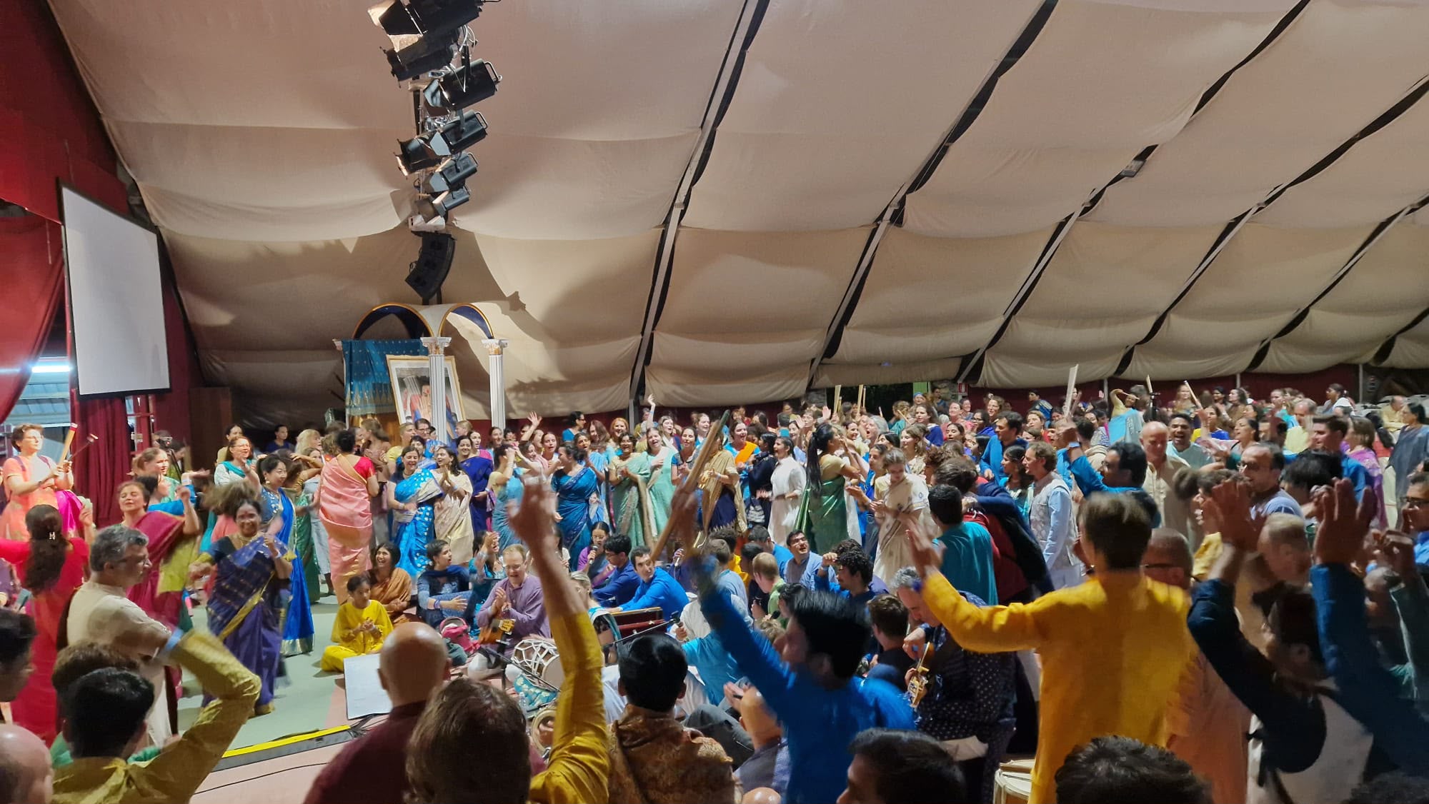 The collective celebrating together inside the marquee